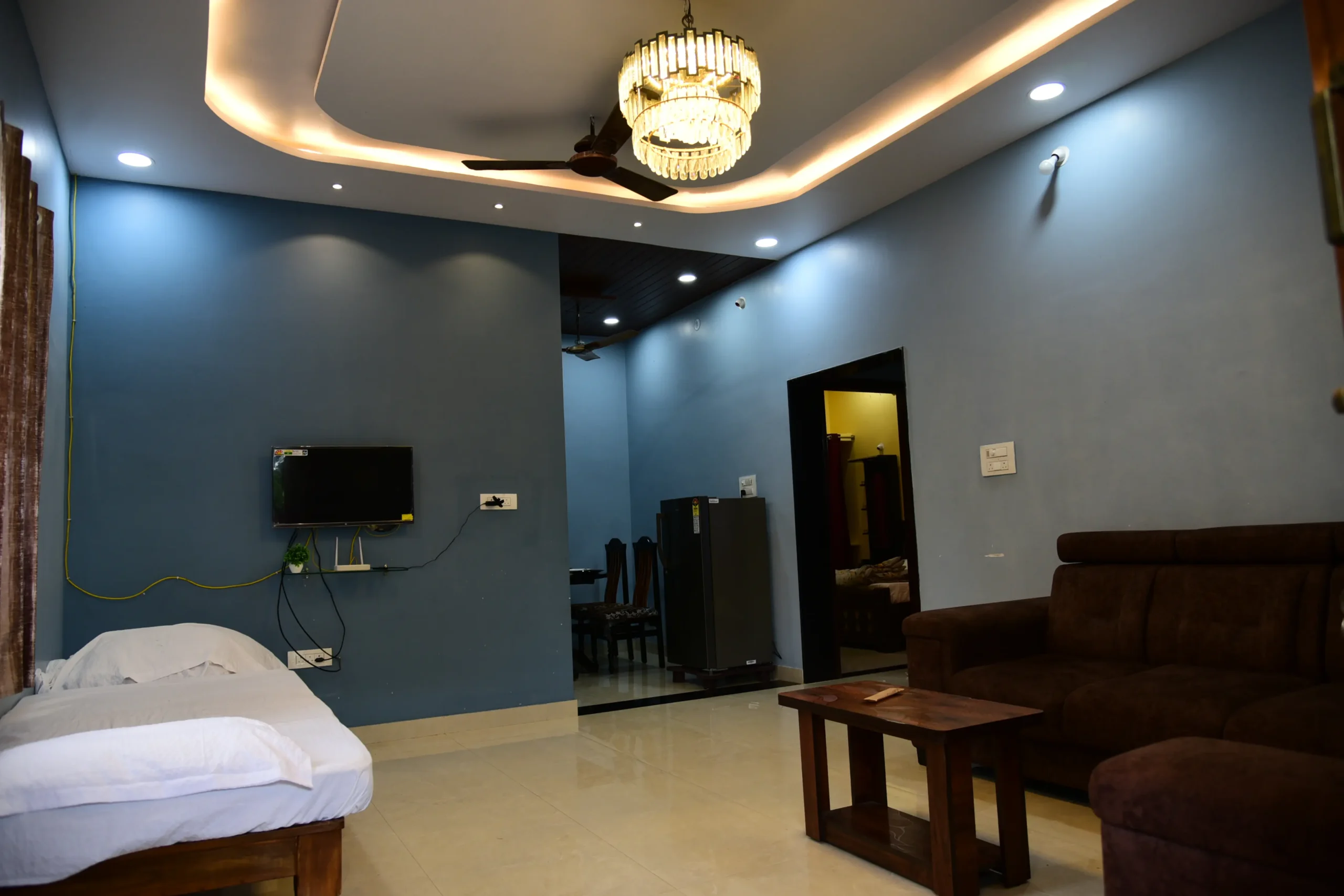 This image displays the interior of a room at Vasavi Home Stay in Mantralayam, Kurnool.